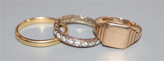 An 18ct yellow gold wedding band, a 9ct gold signet ring and a 9ct white gold and zircon eternity ring (a.f.)